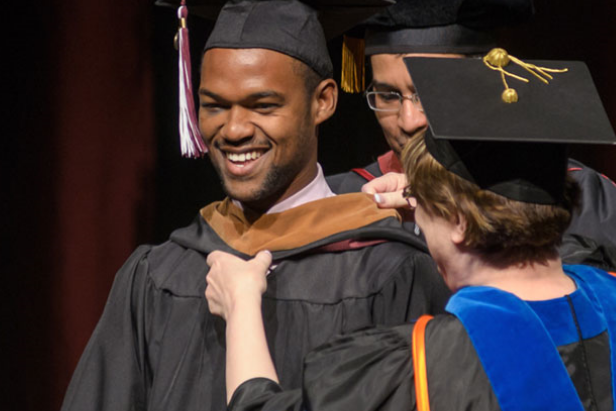 Student being awarded at graduation ceremony